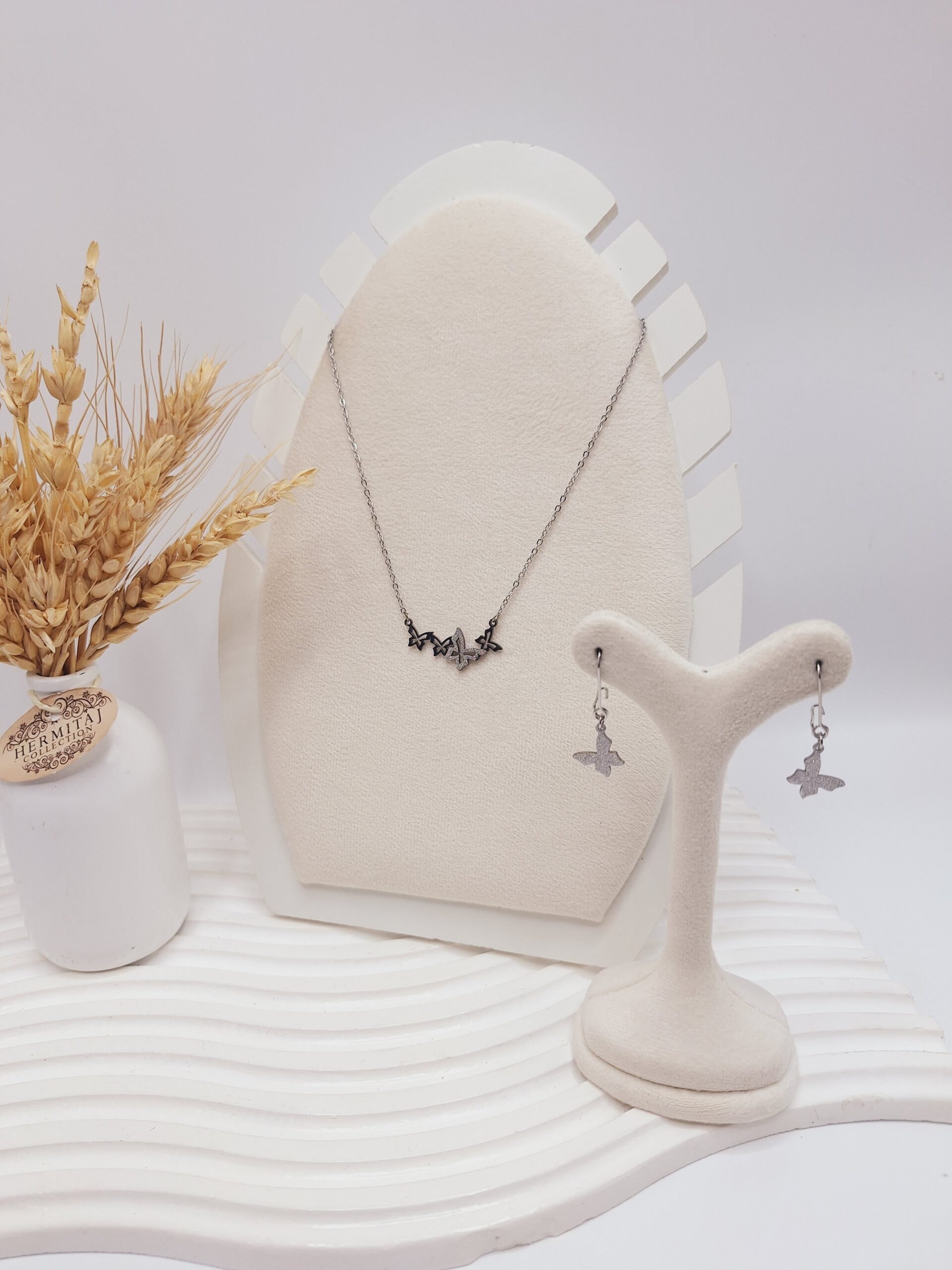 نیم ست طرح پروانه شنی نقره ای استیل