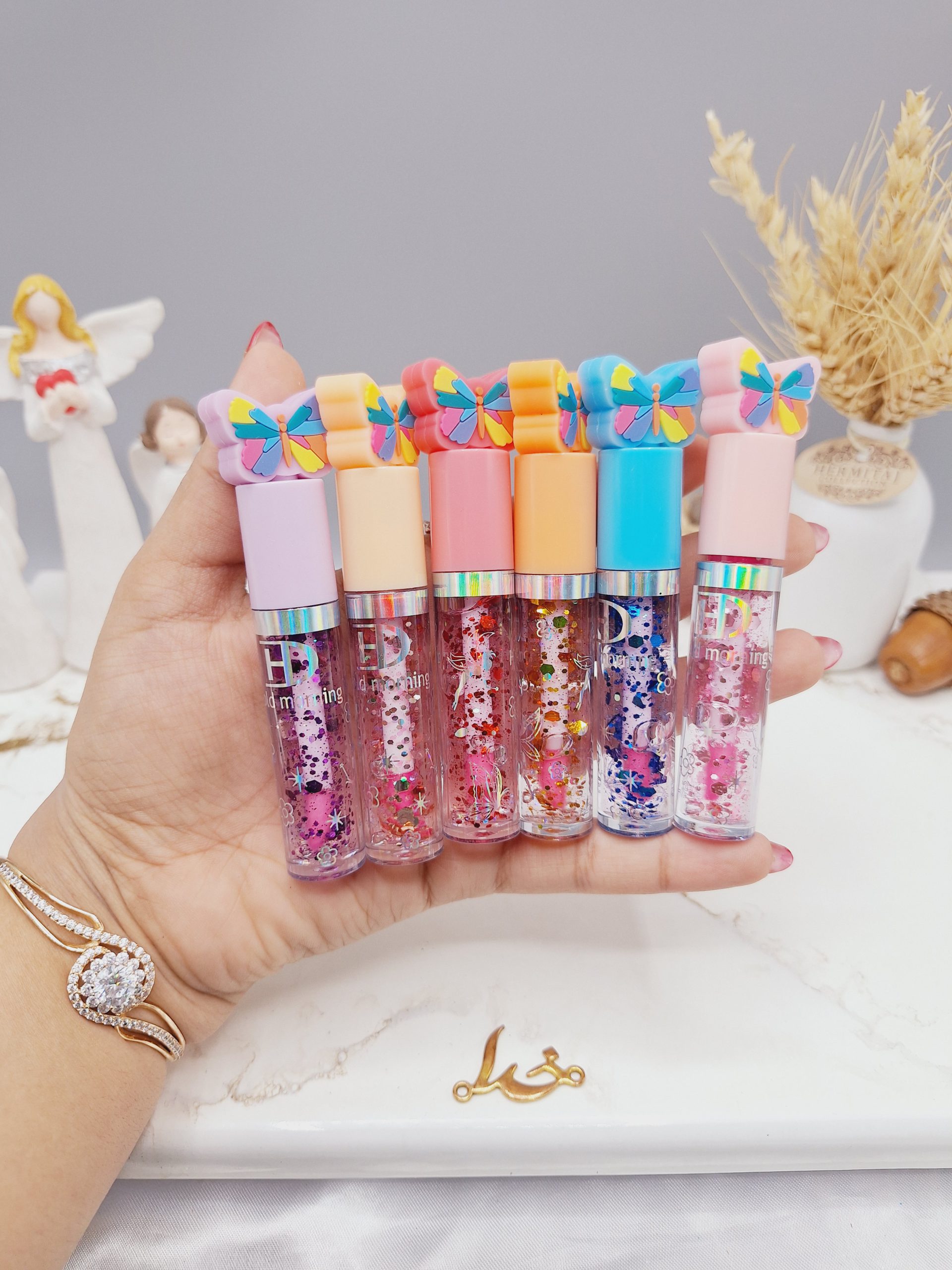 لیپ گلاس گلیتری طرح پروانه هولد مورنینگ Hold morning کد HL5417