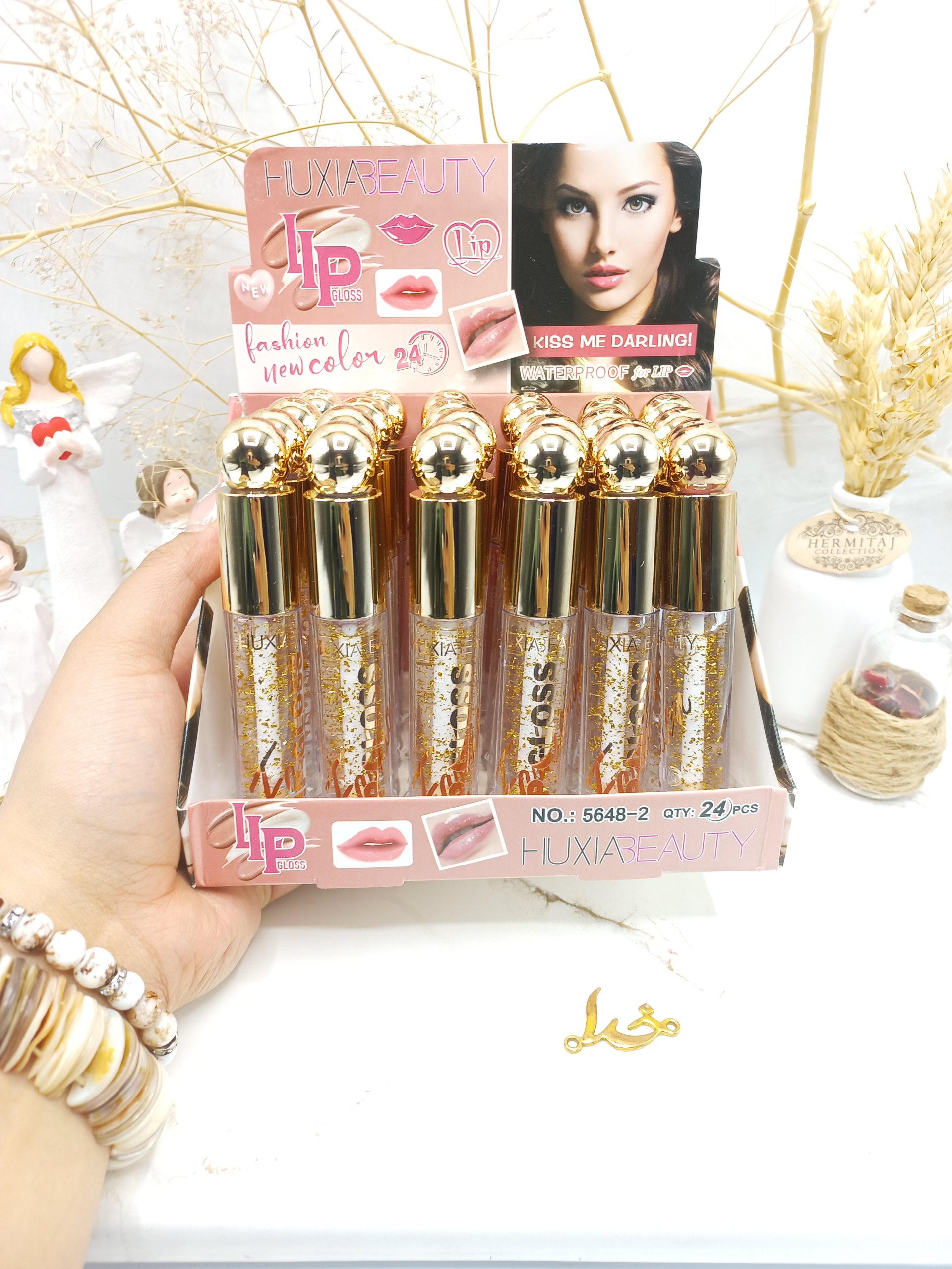 برق لب شاین دار و ضدآب هوکسیا بیوتی ‏HUXABAUTY‏ کد 5648