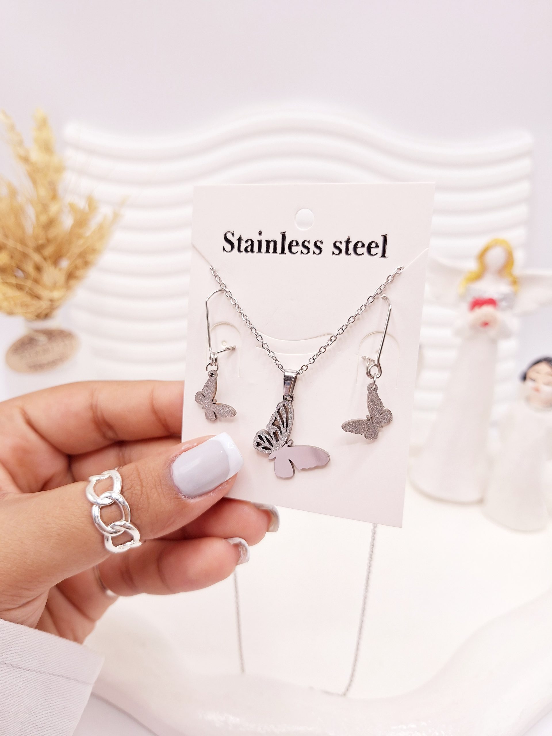 ست گوشواره و گردنبند طرح پروانه مخرج کاری نقره ای استیل