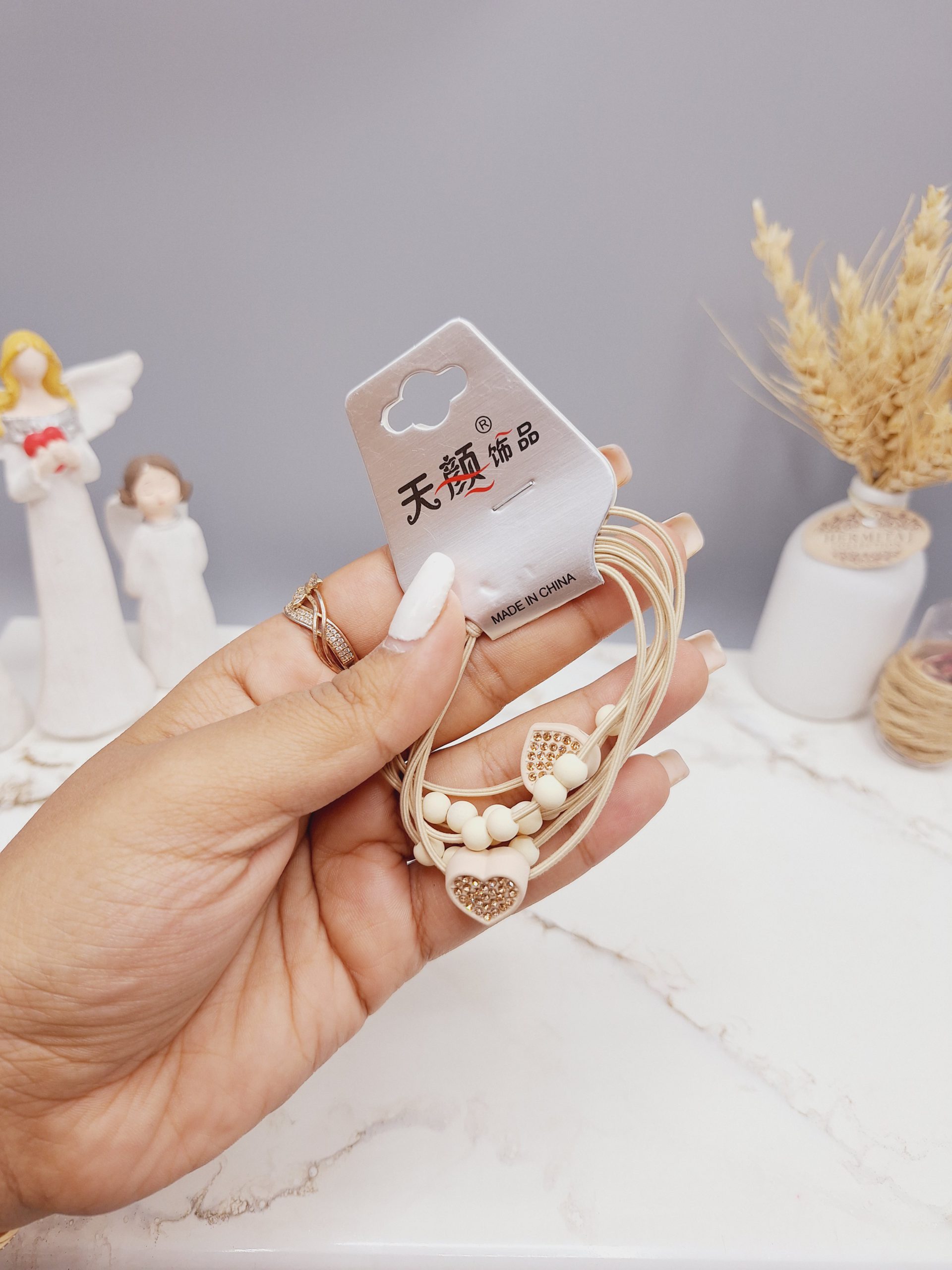 کش مو 2 تایی طرح قلب نگین دار به همراه مروارید کد 0012 رندم