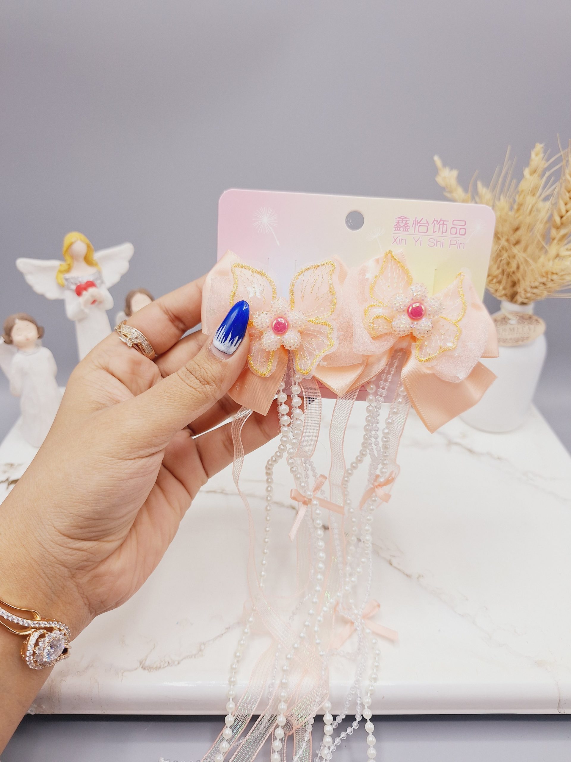 ست 2 تایی گیره مو پاپیونی و گل  همراه با آویز نواری و نگین دار