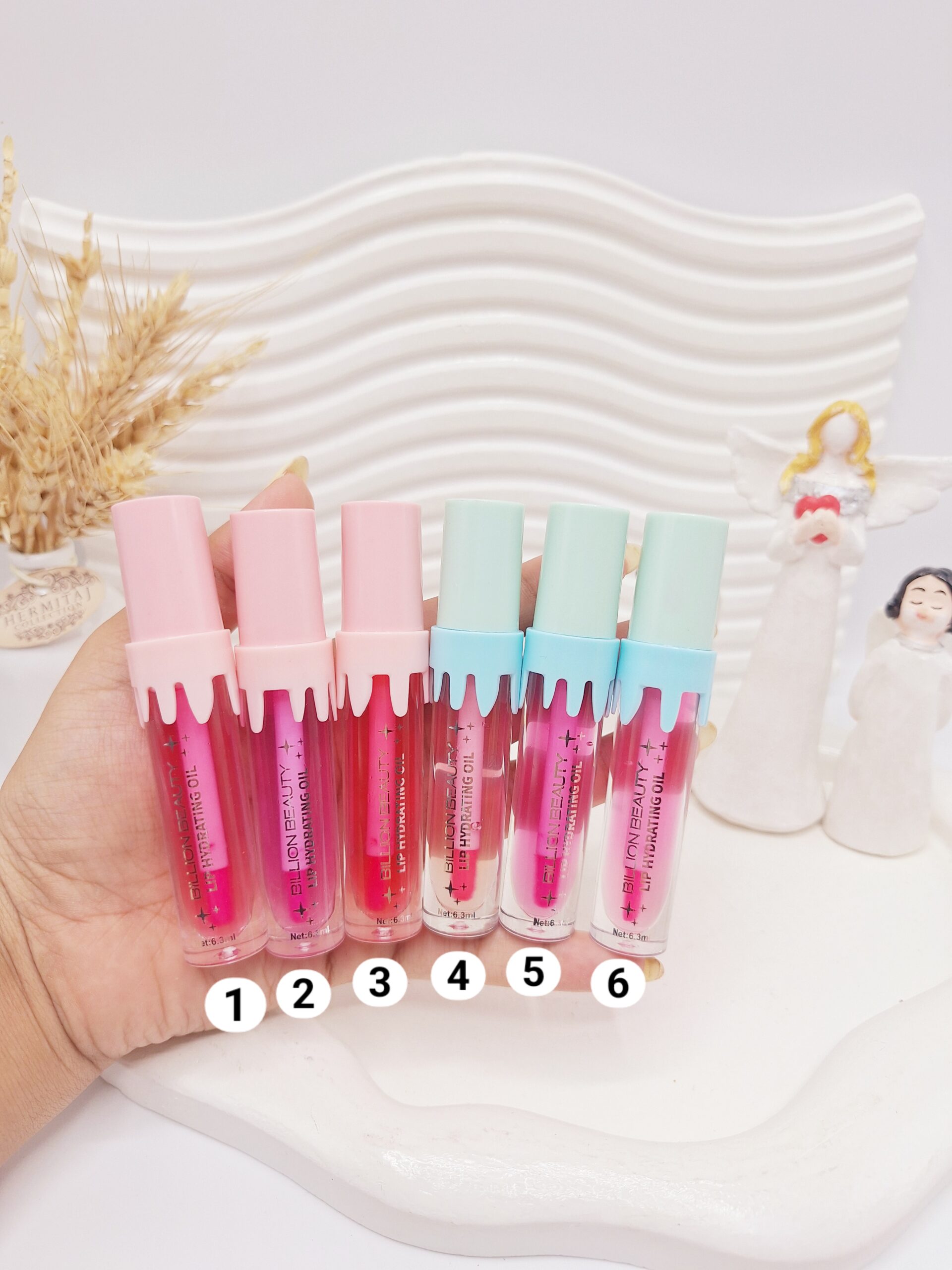 لیپ گلاس جذاب آیس پکی برند BILLION BEAUTY کد B80012