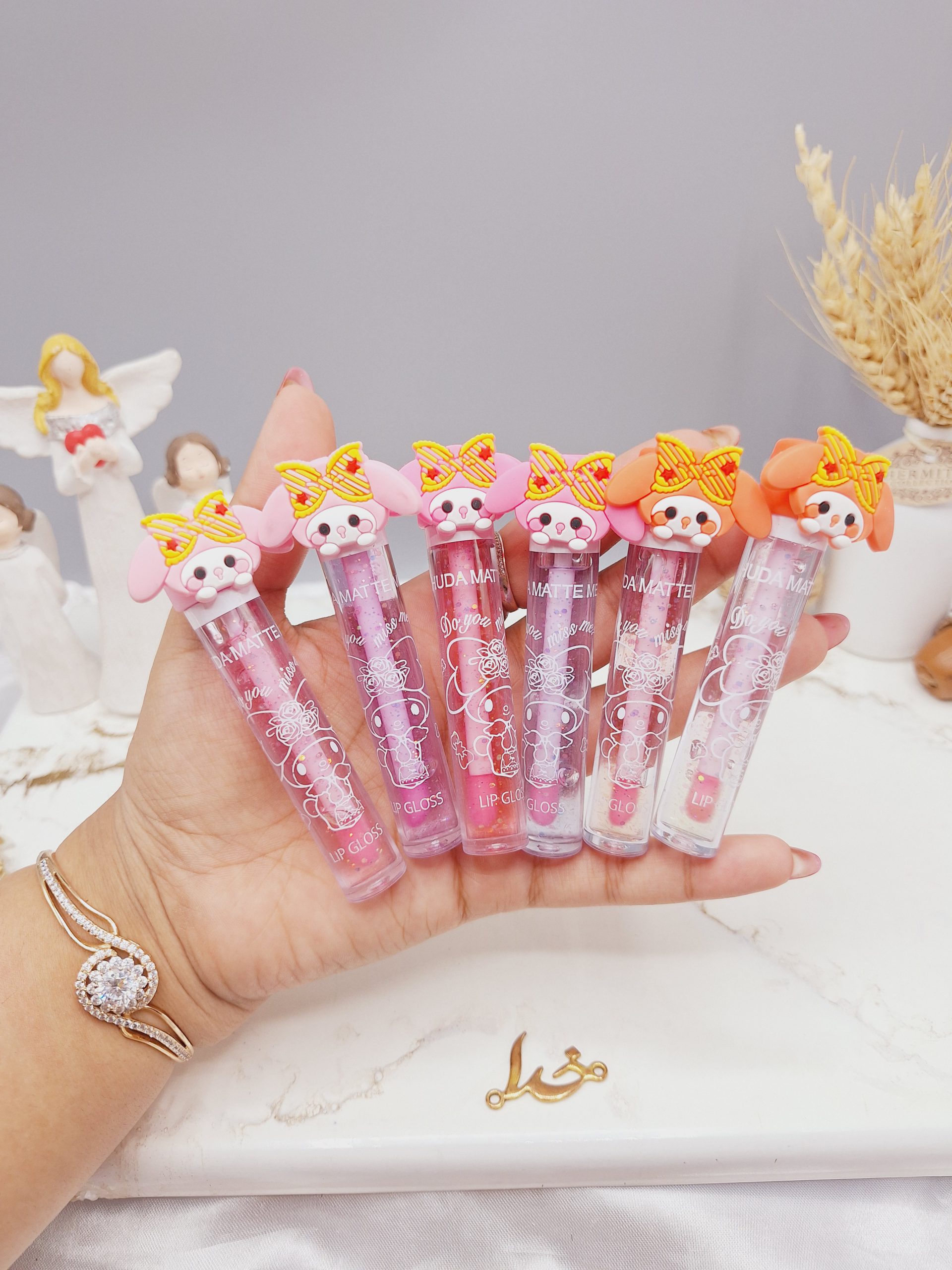 لیپ گلاس شاین دار  طرح فانتزی برند هدا مات می HUDA MATTE ME کد X-358