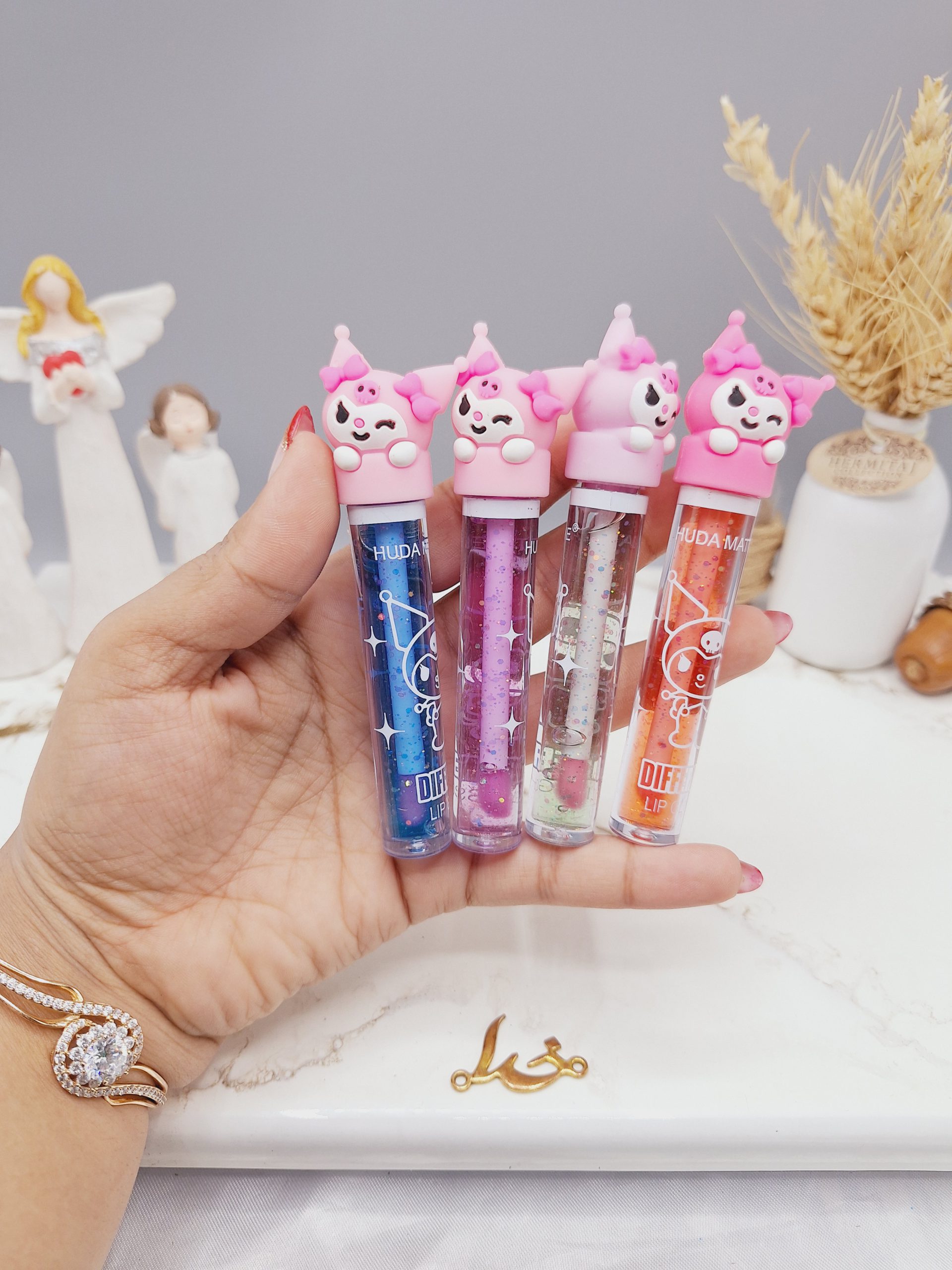 لیپ گلاس شاین دار طرح دلقک بامزه برند هدا مات می HUDA MATTE ME کد X326