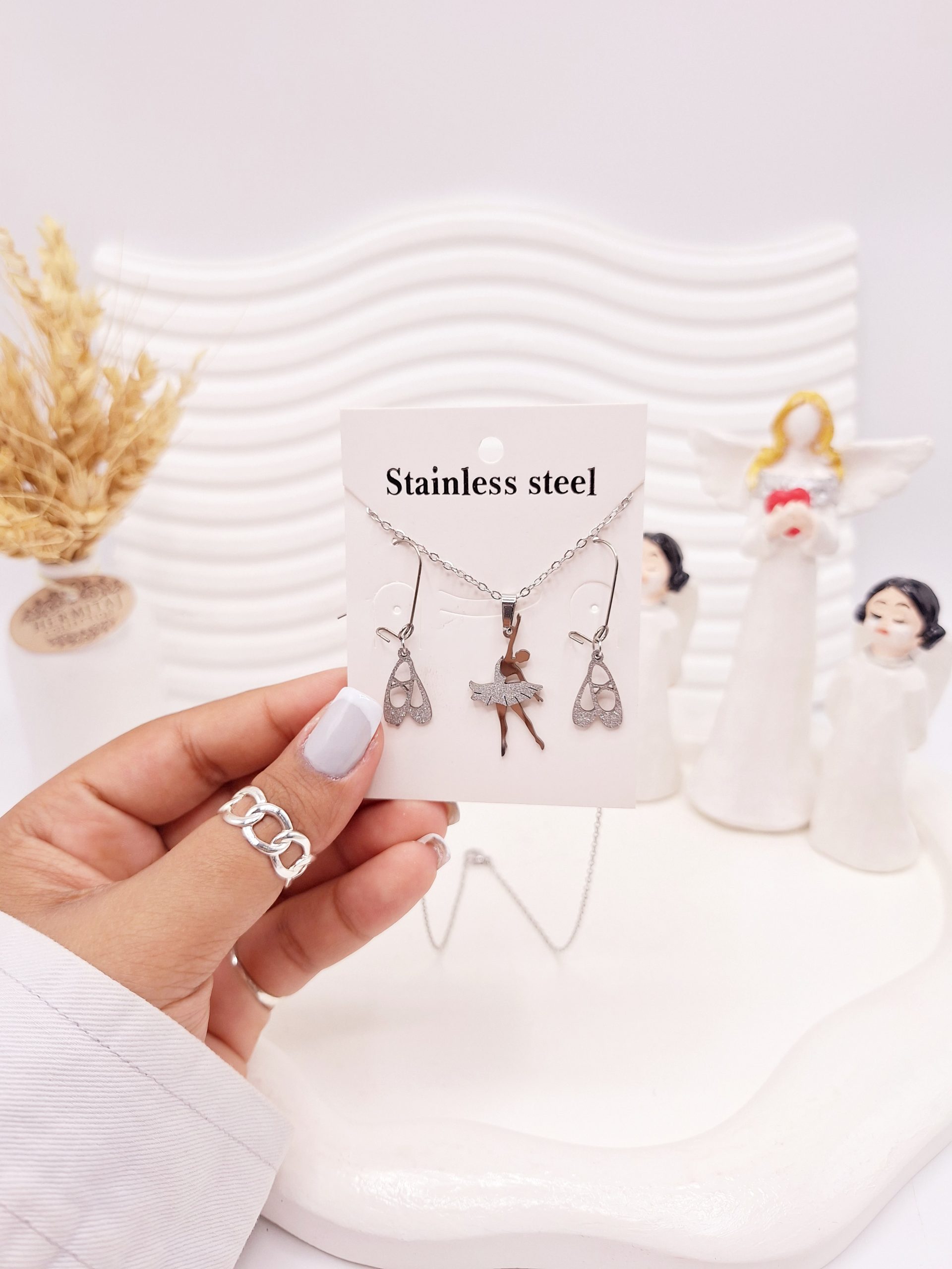 ست گوشواره و گردنبند طرح بالرین نقره ای استیل