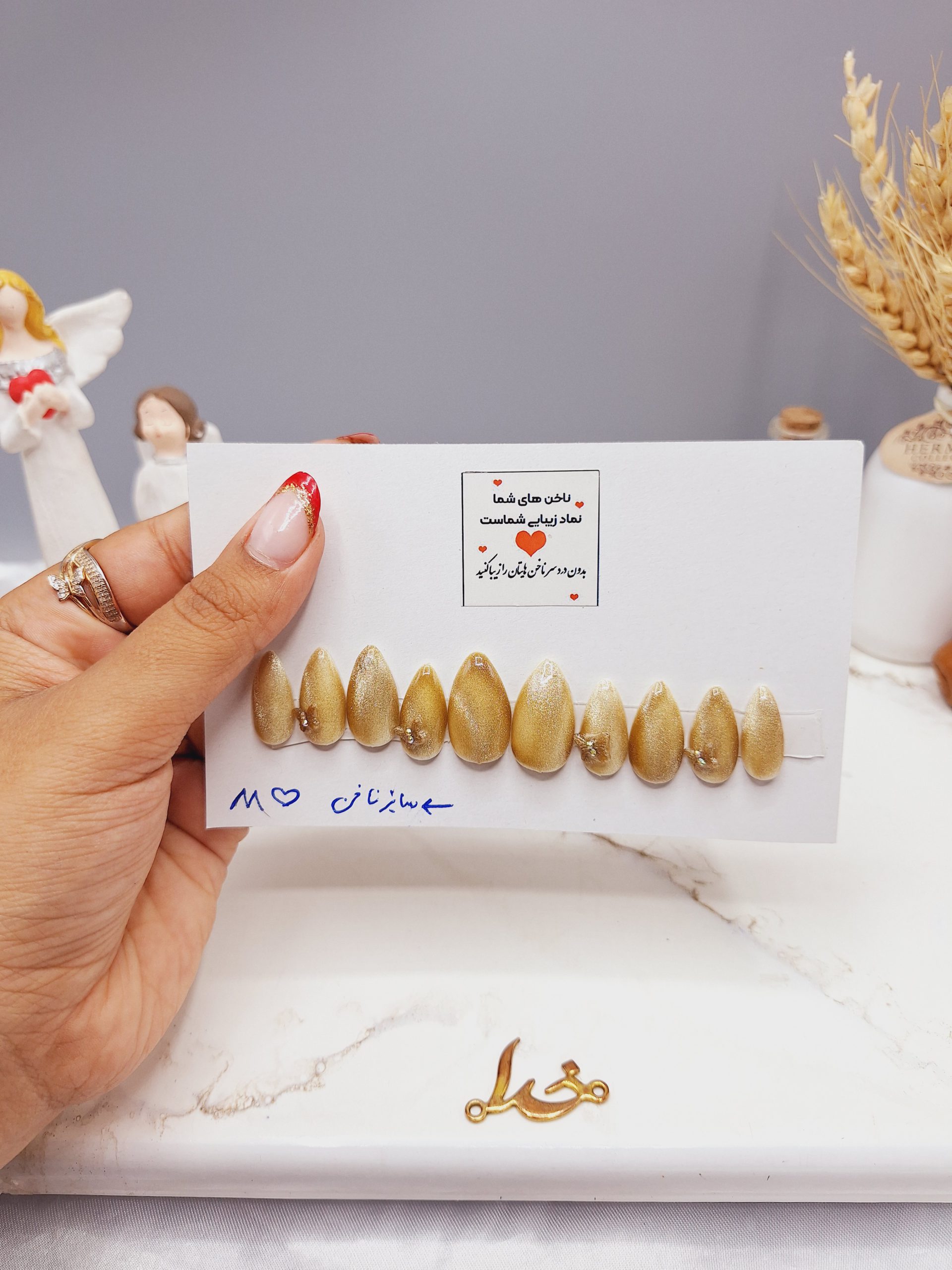 ناخن مصنوعی با مواد کاشت درجه 1 رنگ طلایی مدل آیس ژل شاین دار