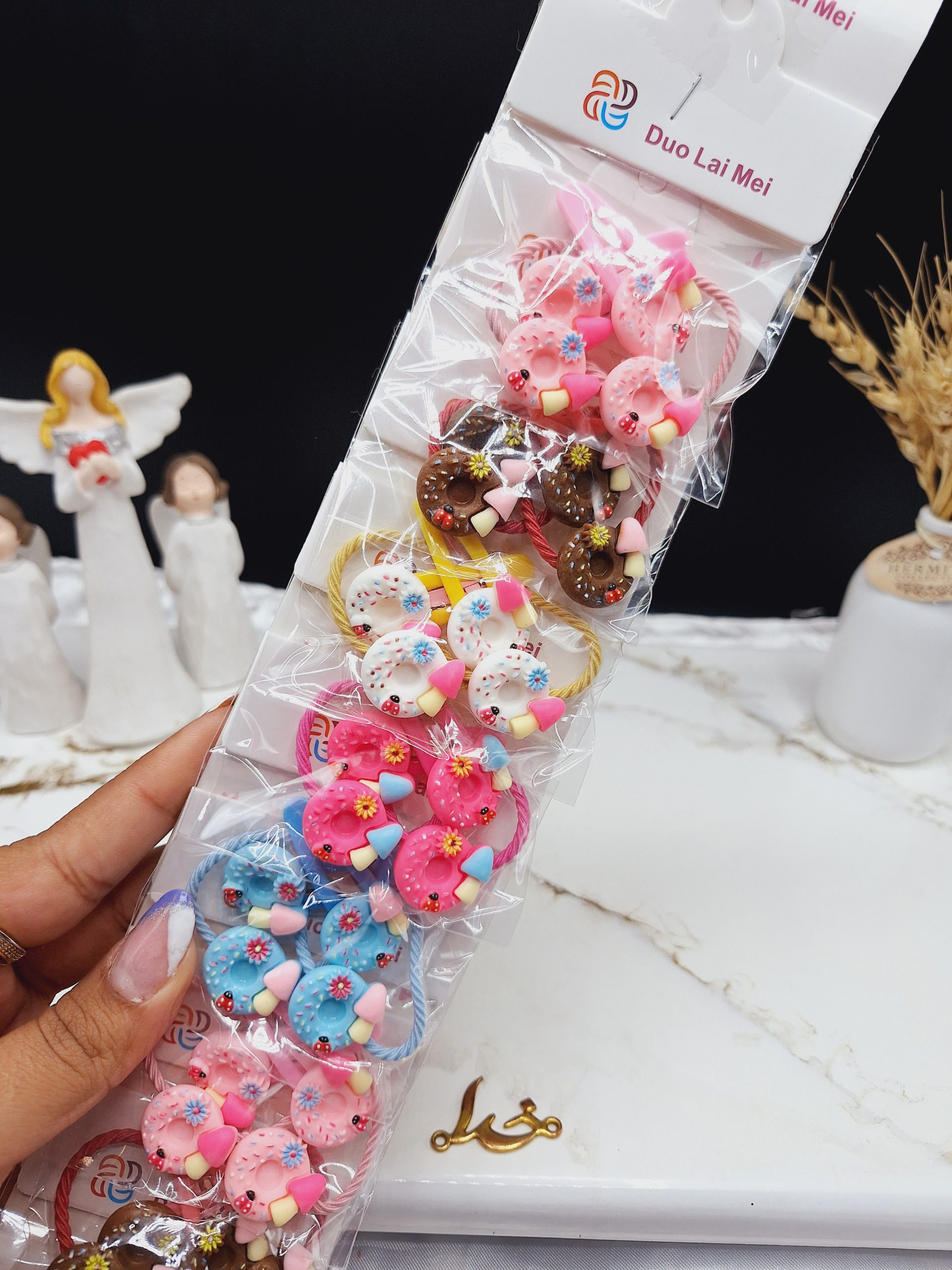 پک 10 عددی گیره و کش مو طرح دونات