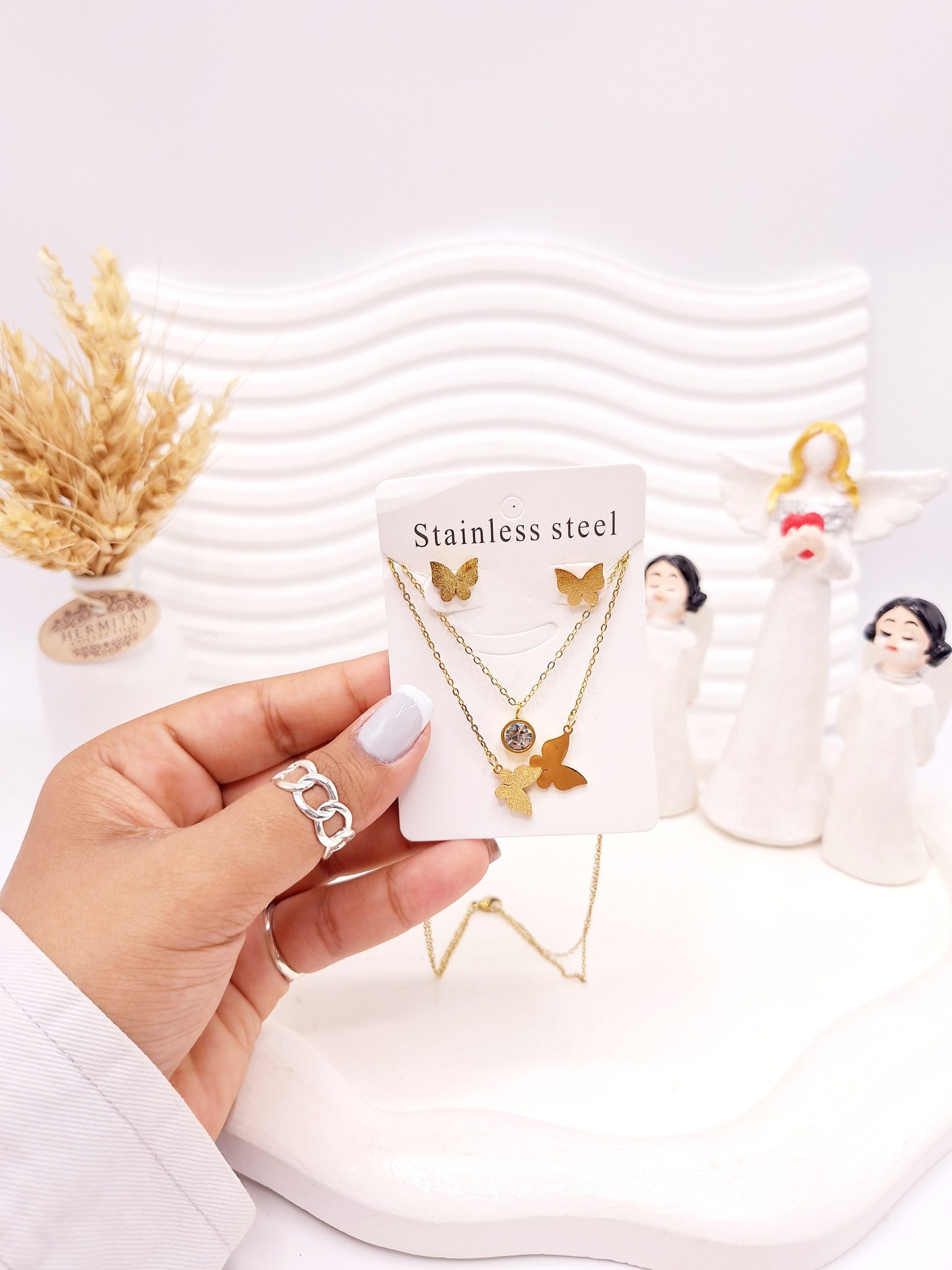 ست گوشواره و گردنبند دو لاین پروانه ای رنگ طلایی استیل