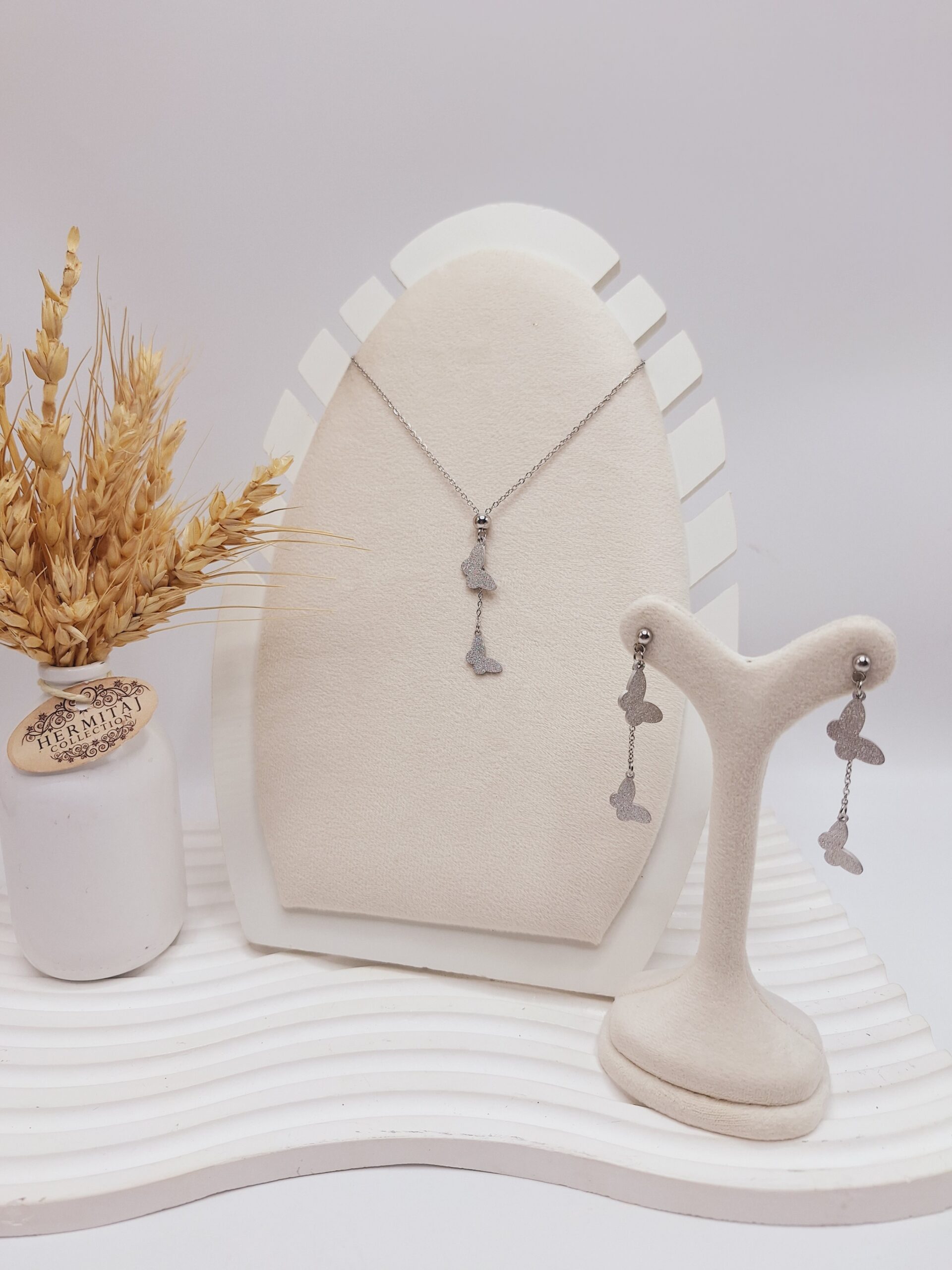 ست گوشواره و گردنبند طرح پروانه نقره ای استیل