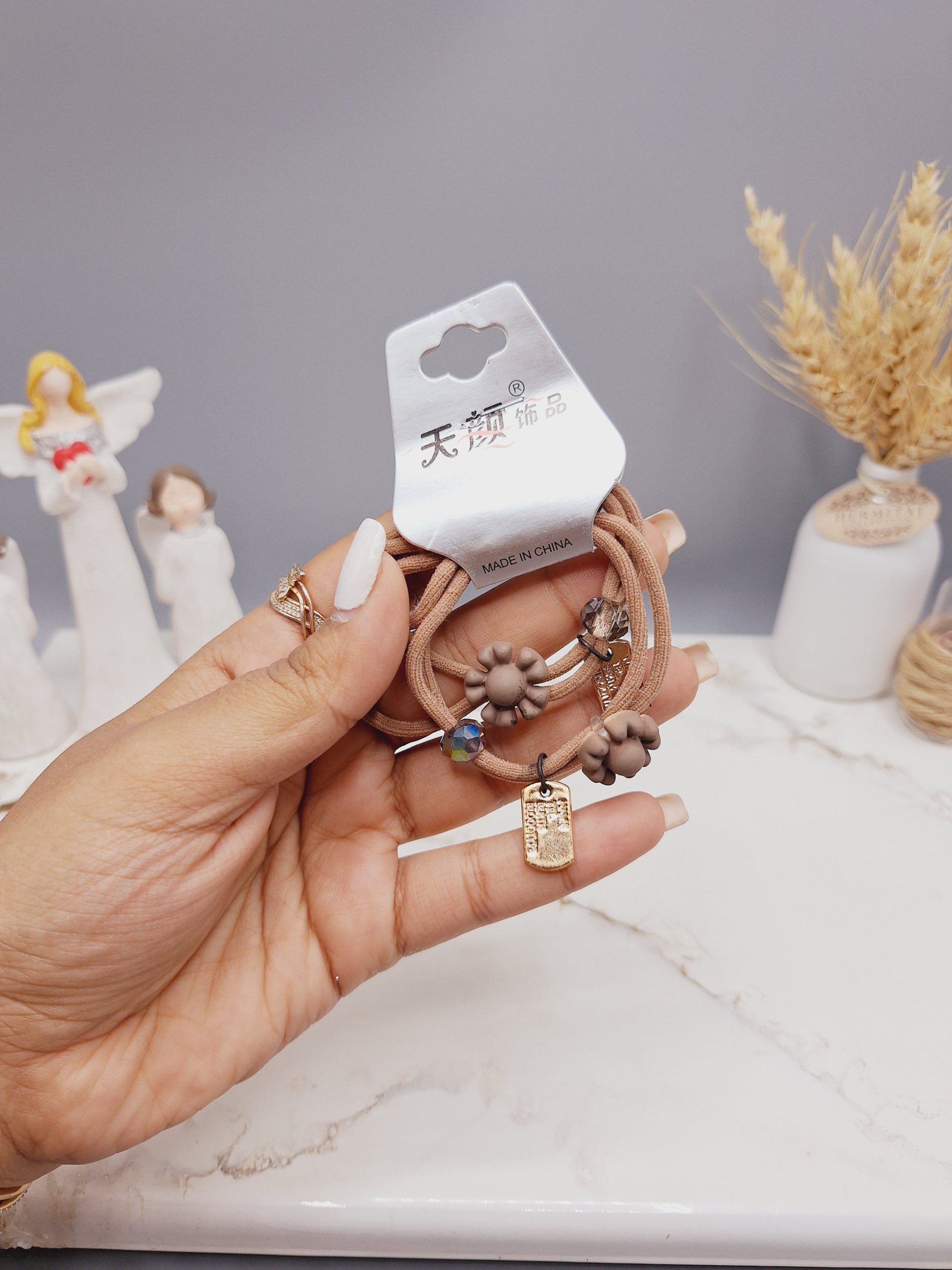 کش مو 2 تایی طرح گل و مروارید و اتیکت کد 0012 رندم