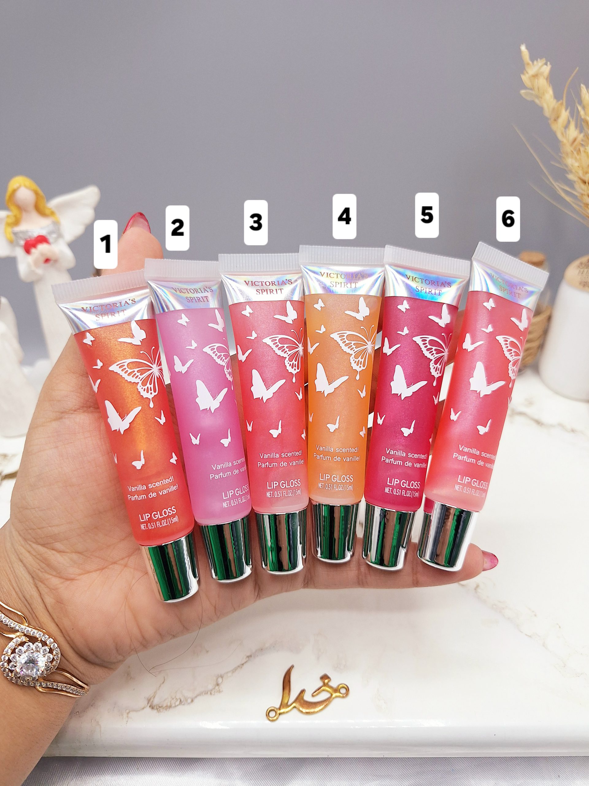 لیپ گلاس تیوپی شاین دار طرح پروانه از برند ویکتوریا اسپریت