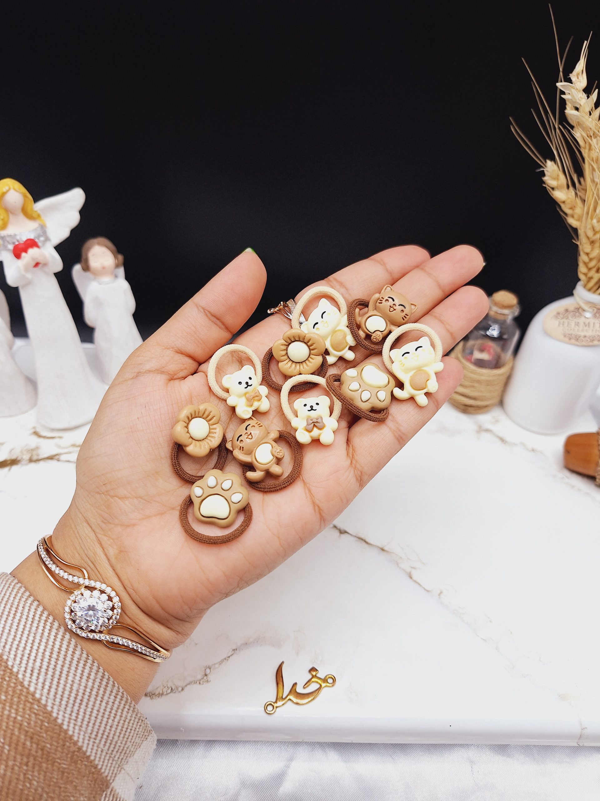 پک کش مو 10 عددی رنگ نود طرح گل و گربه کیوت