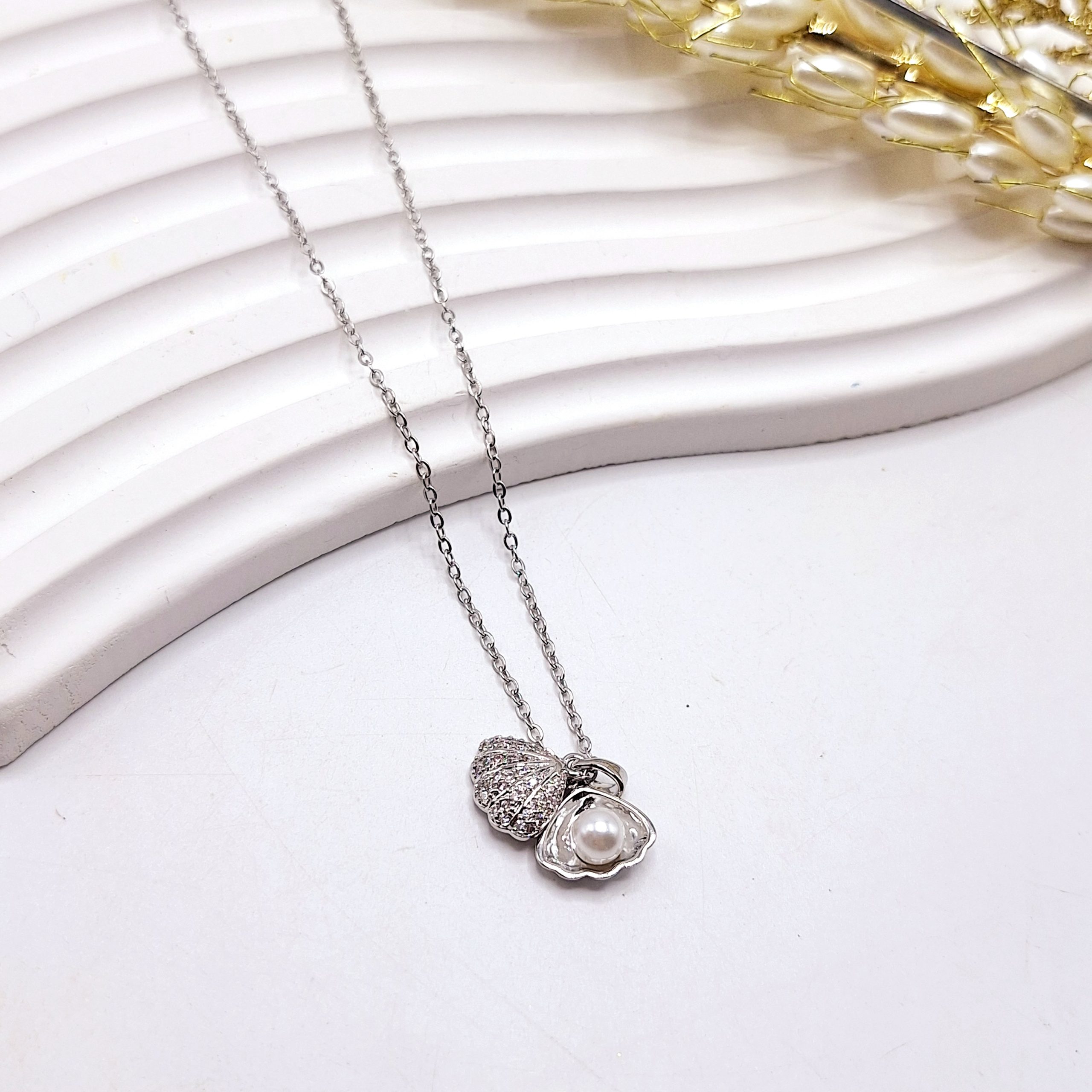 گردنبند زنانه طرح صدف مراوریدی فول نگین  استیل