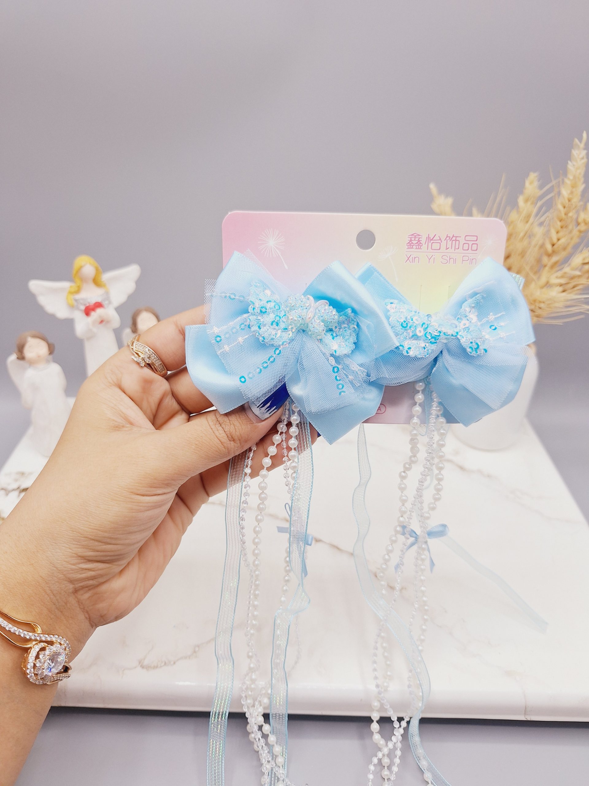 ست 2 تایی گیره مو پاپیونی پولک دار همراه با آویز نواری و نگین دار