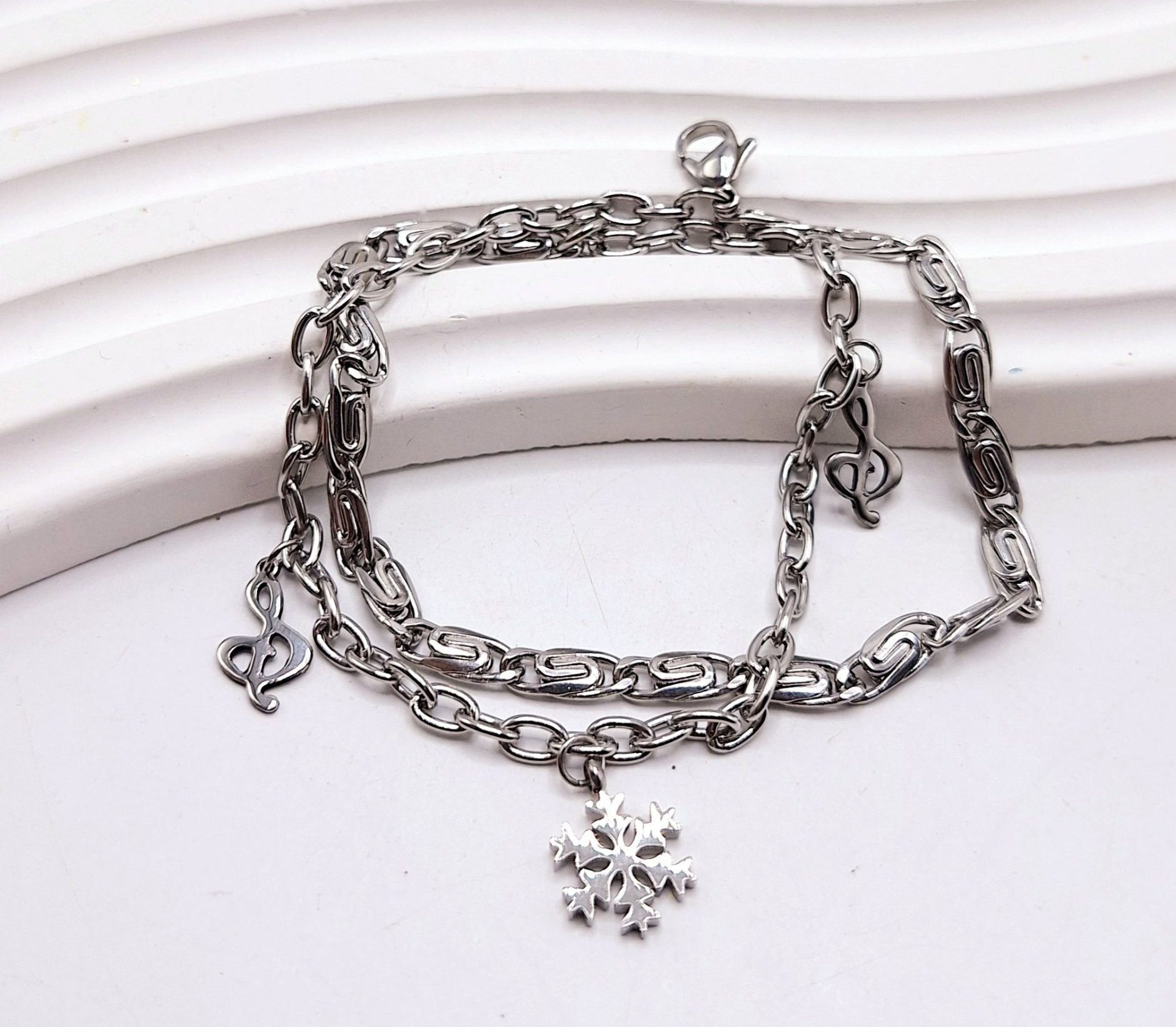 دستبند دولاین طرح دونف برف و موزیک استیل