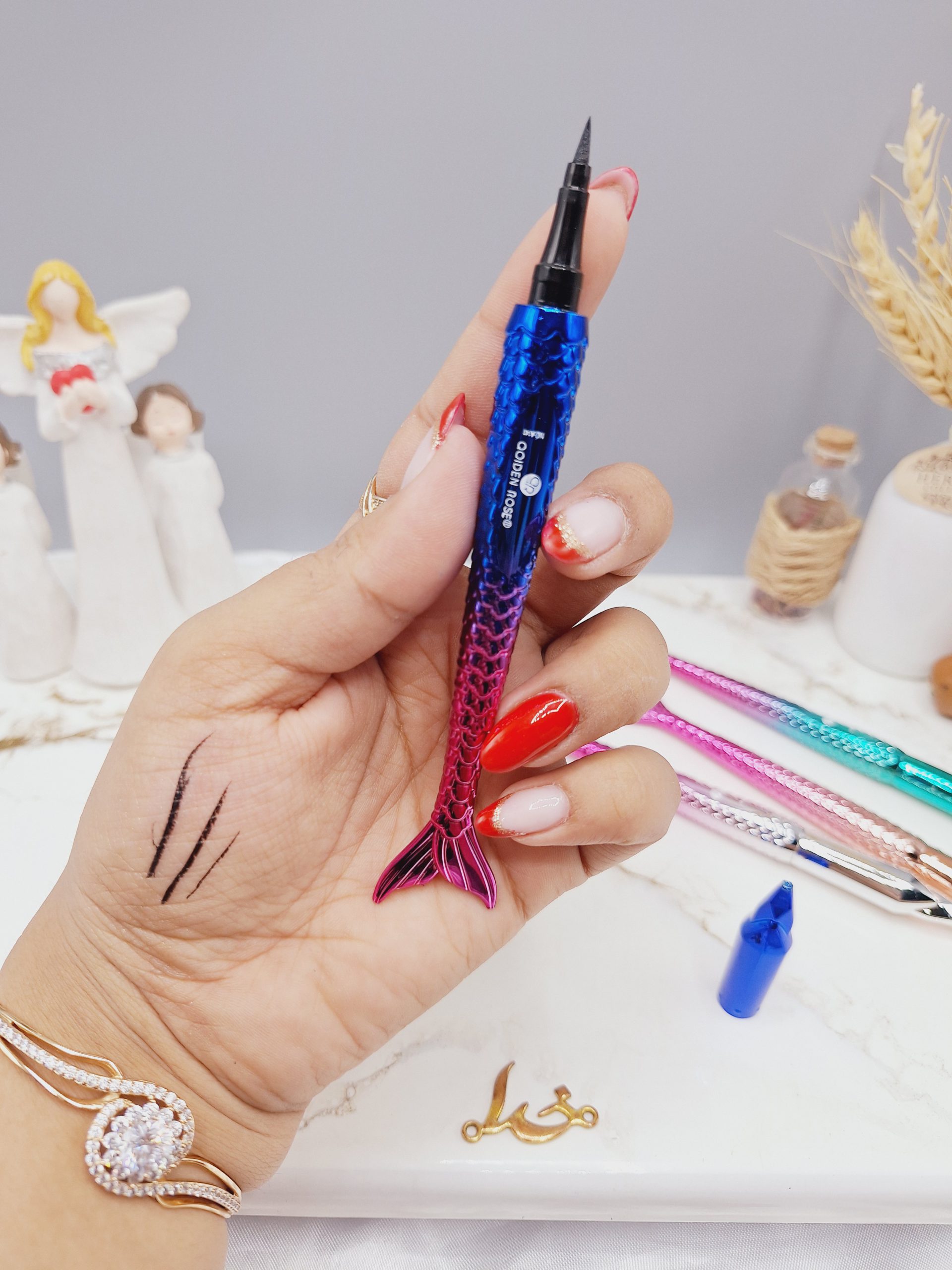 خط چشم ماژیکی طرح پری دریایی برند QOIDEN ROSE کد A141