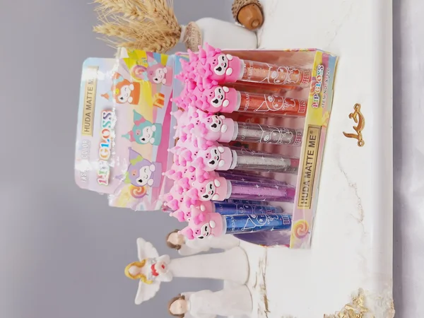 لیپ گلاس شاین دار طرح دلقک بامزه برند هدا مات می HUDA MATTE ME کد X326