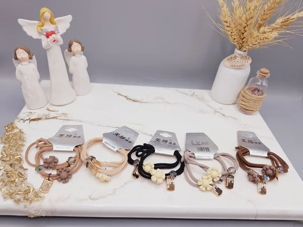 کش مو 2 تایی طرح گل و مروارید و اتیکت کد 0012 رندم