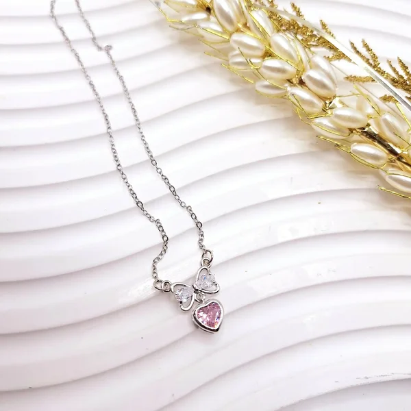 گردنبند زنانه جواهری قلب و پاپیون صورتی استیل