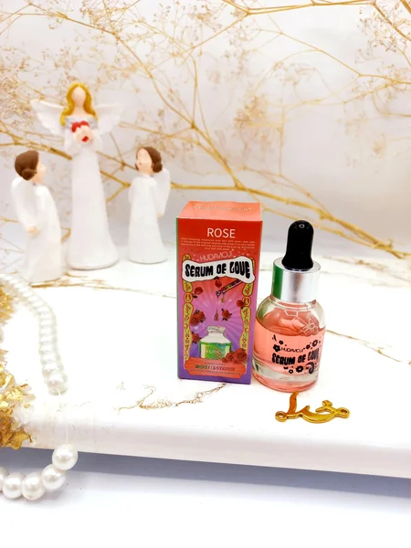 سرم روشن کننده پوست مدل گل رز هدی موجی HUDA MOJI حجم 20 ml کدEC001