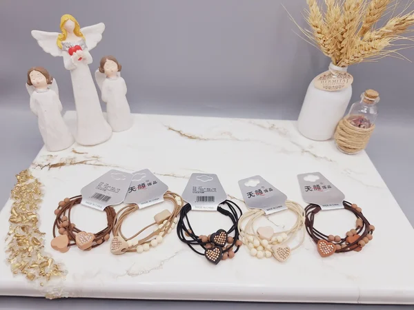 کش مو 2 تایی طرح قلب نگین دار به همراه مروارید کد 0012 رندم