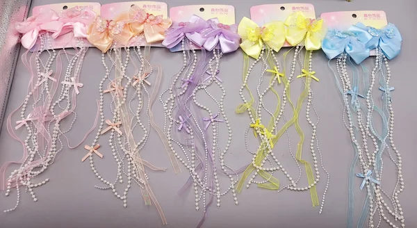 ست 2 تایی گیره مو پاپیونی پولک دار همراه با آویز نواری و نگین دار