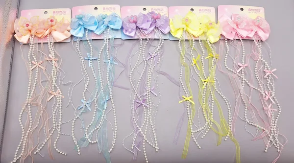 ست 2 تایی گیره مو پاپیونی و گل  همراه با آویز نواری و نگین دار