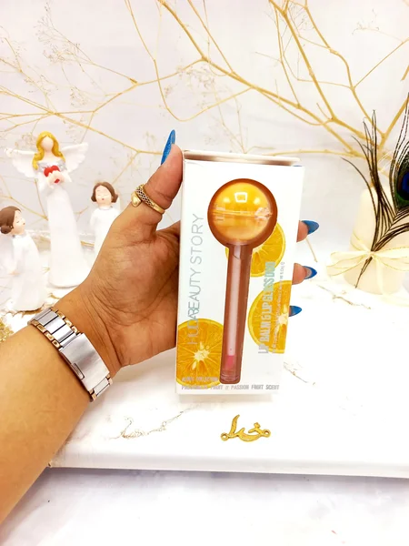 برق لب و بالم لب آبنباتی پرتقال هدا بیوتی استوری HUDA BEAUTY STORY