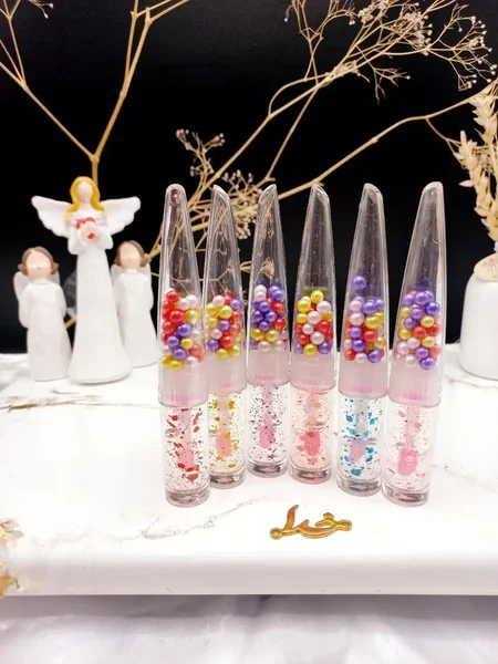 برق لب زیبای گلیتر دار توپی رنگی مجیک MAGIC  کد LC1307