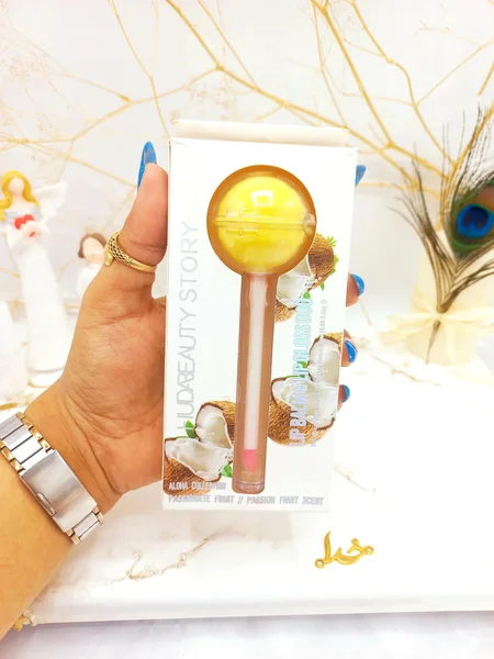 برق لب و بالم لب آبنباتی نارگیل هدا بیوتی استوری HUDA BEAUTY STORY