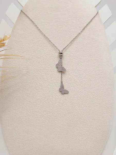 ست گوشواره و گردنبند طرح پروانه نقره ای استیل