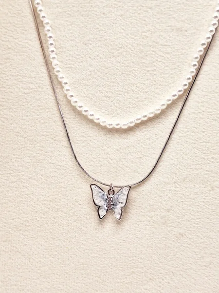 گردنبند پینترستی پروانه زنجیر ماری و مراوریدی