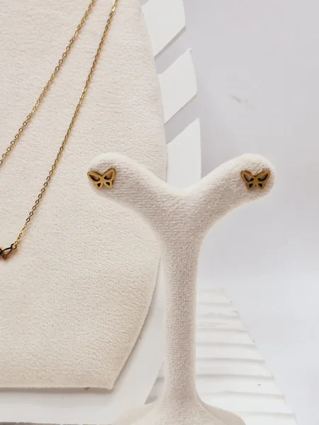 ست گوشواره و گردنبند دو لاین پروانه های ریز و آویز نگین دار رنگ طلایی استیل